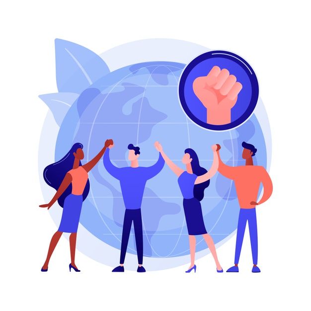 Fit man sitting cross-legged in gym after exercise session.